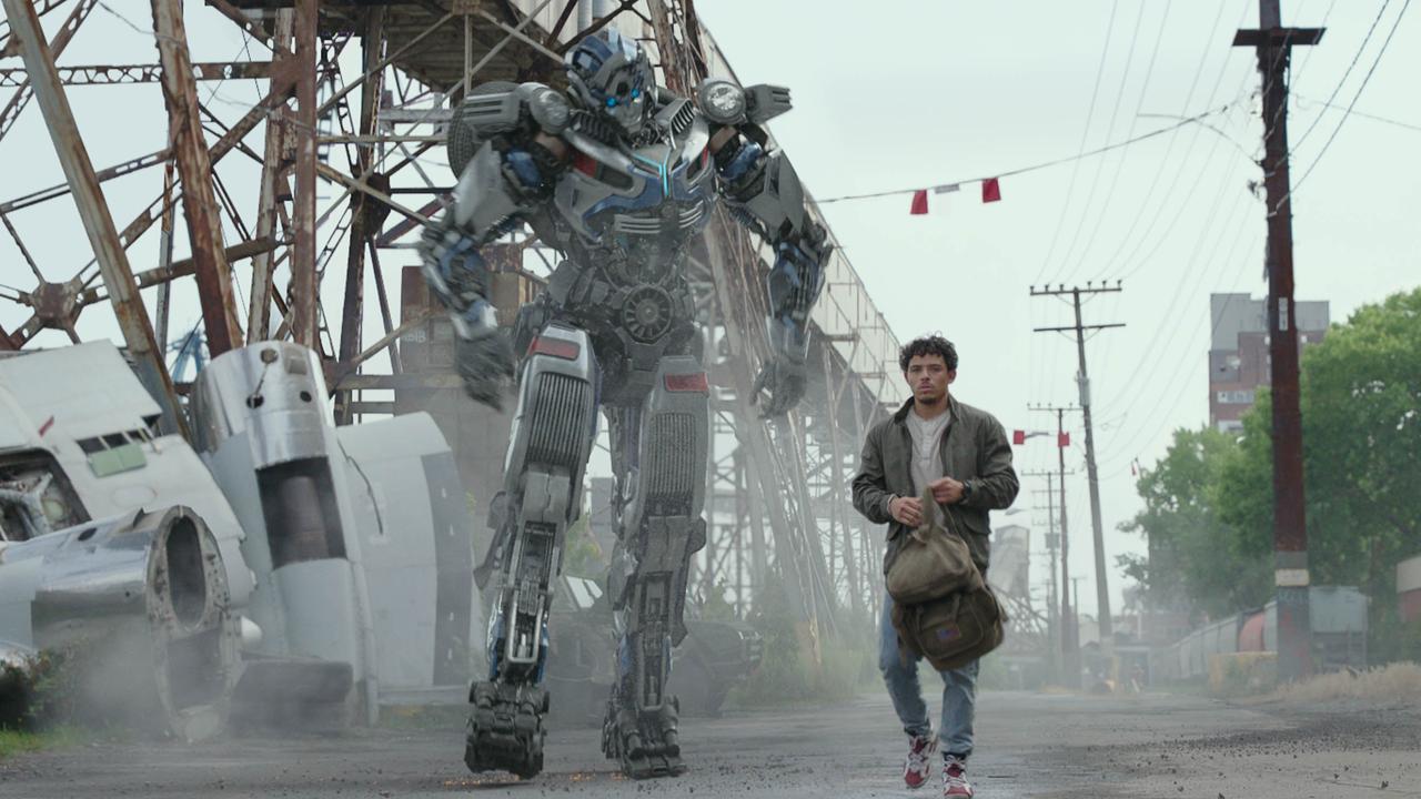 Mirage (voiced by comedian Pete Davidson) and Anthony Ramos in Transformers: Rise of the Beasts.