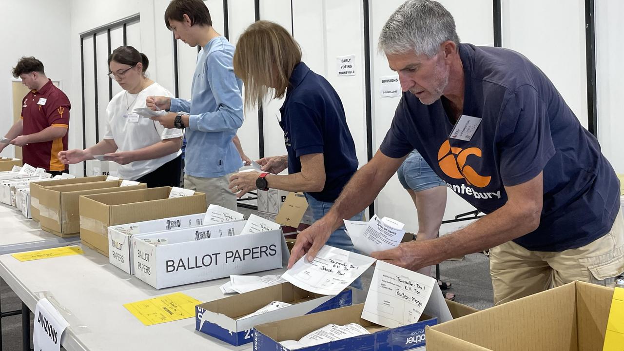 Counters begin to sort through the ballot papers at Townsville’s ECQ office in West End, as soon as voting booths closed. Picture: Chris Burns