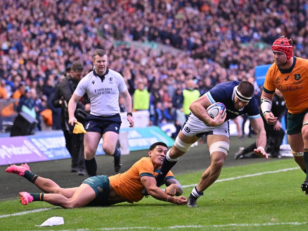 Josh Bayliss dives for the line to score a try for Scotland. Picture: AFP