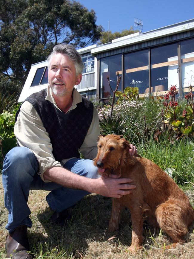 A more casual Mr Rankin with dog Red at Boat Harbour on Tasmania’s North-West Coast. Picture: CHRIS KIDD