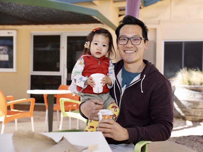 Tony So and his daughter Amelie, 2, celebrated cafes and pubs reopening on Friday afternoon. Picture: EMMA MURRAY