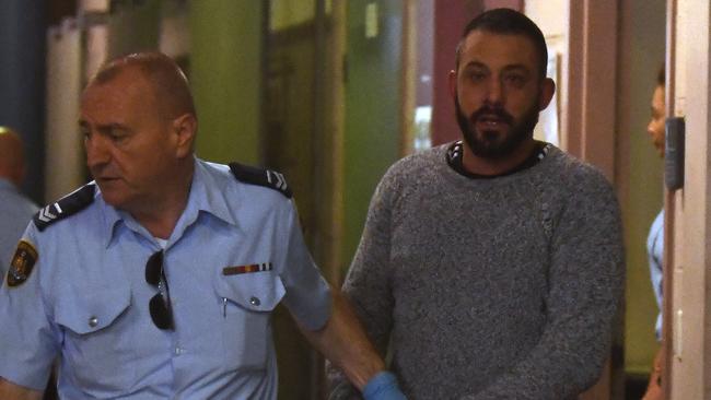 Ricardo Barbaro being escorted to a prison van at Burwood Court in Sydney. Picture: AAP/Joel Carrett