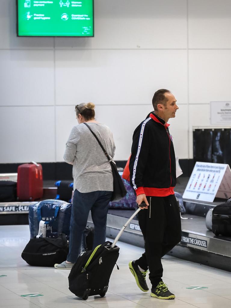 Passengers at Brisbane Domestic Airport as Jetstar and Virgin scheduling flights into Sunshine Coast and Cairns after borders begin to re-open in Queensland. Picture: NCA NewsWire David Kapernick