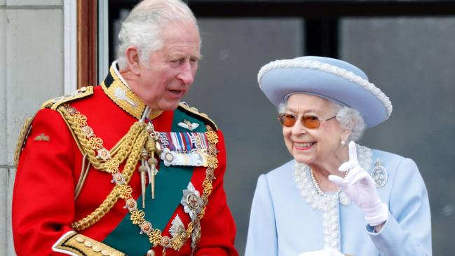 Prince Charles and Queen Elizabeth II watch a flypast from the balcony of Buckingham Palace during Trooping the Colour. Picture: Getty Images