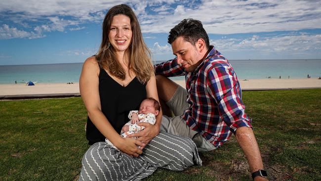 ‘It was all very quiet’ … Clarissa Carradine and husband Jesse Riseborough with three-week-old baby Florence at Perth’s City Beach. Picture: Colin Murty