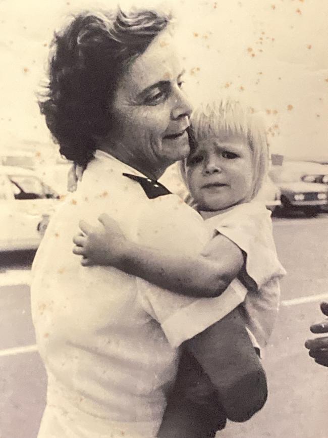 Brenda Brocker is handed to a Salvation Army representative as she is evacuated from Cyclone Tracy. Cyclone Tracy 50 Years On, Sky News Image