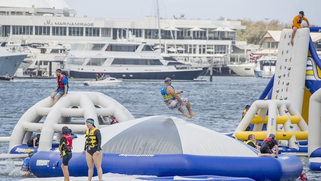 People having fun at the inflatable water park at Southport Broadwater on New Year's Eve. Picture: Jerad Williams