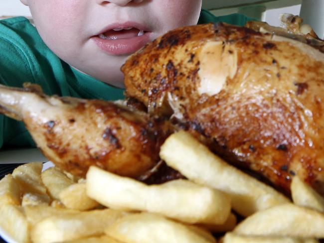 Boy Jaxen Wharfe, 3, gets stuck into his roast chicken dinner.