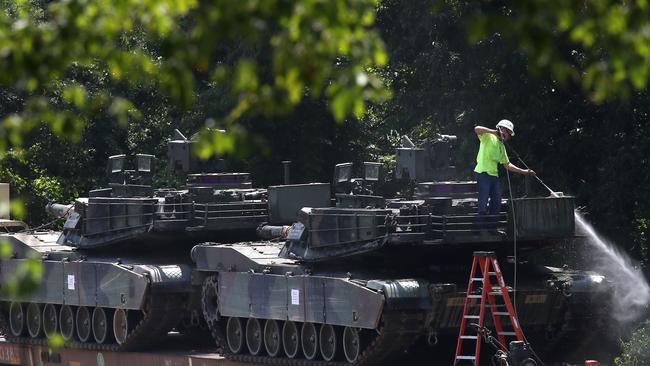 WASHINGTON, DC - JULY 02: A worker washes one of two M1A1 Abrams tanks that are loaded on rail cars at a rail yard on July 2, 2019 in Washington, DC. President Trump asked the Pentagon for military hardware, including tanks, to be displayed during Thursdays July 4th Salute to America celebration at the Lincoln Memorial.   Mark Wilson/Getty Images/AFP == FOR NEWSPAPERS, INTERNET, TELCOS & TELEVISION USE ONLY ==