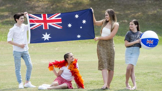 Famous Performing Arts Studio students Oscar Langmar, 14, Chelsea Earle, 12, Annabelle Gross, 16, &amp; Ellie Lazanas, 12, pose for a photograph ahead of Australia Day celebrations at Storey Park at Hornsby. (AAP IMAGE / Troy Snook)