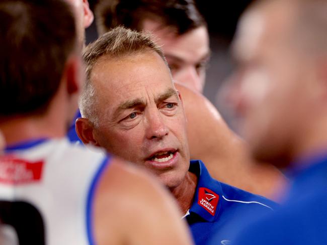 Alastair Clarkson speaks to his charges on Saturday night. Picture: Kelly Defina/AFL Photos/via Getty Images.