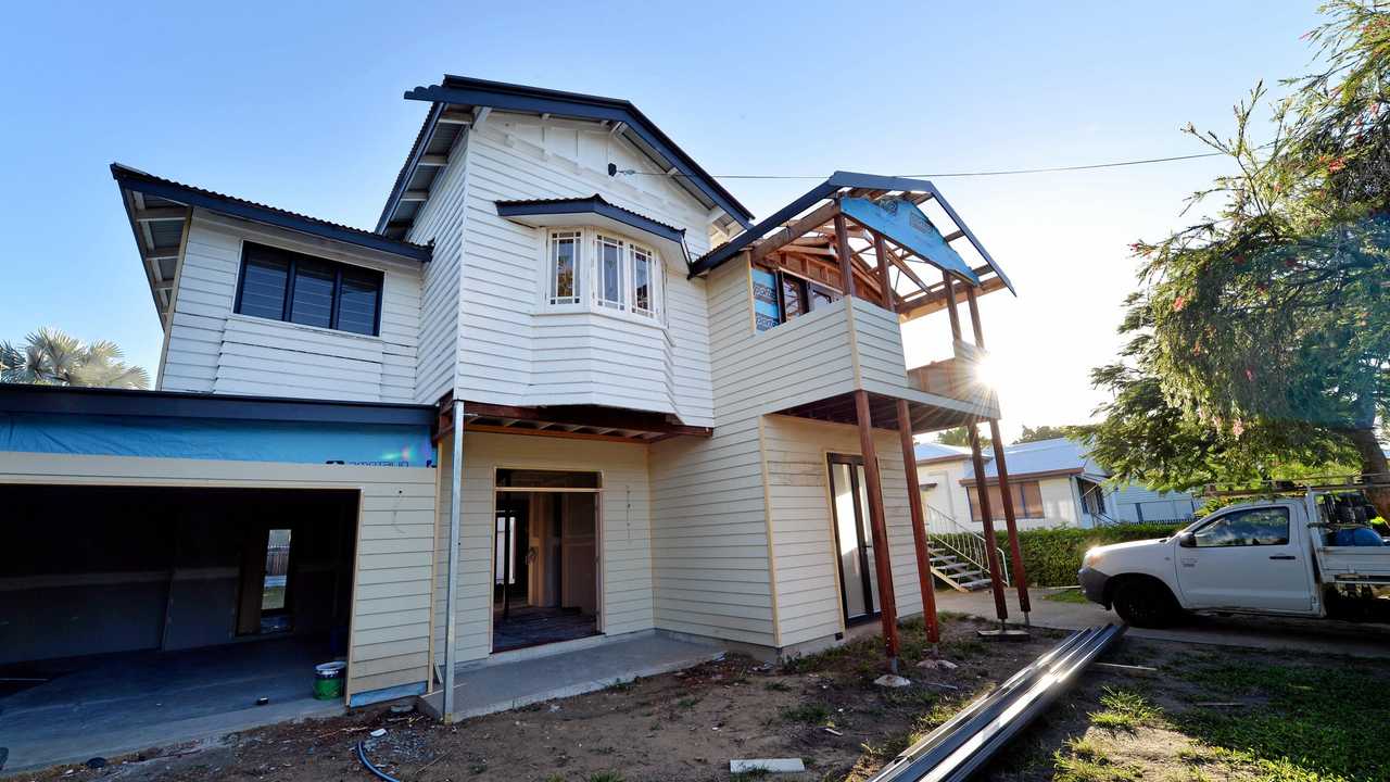 Mackay house-flippers Madison Strutynski and Michael Cotter at their Hunter St, West Mackay property. Picture: Stuart Quinn