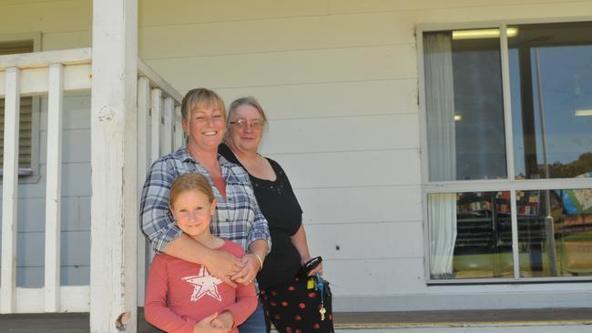 Elly McAuliffe with daughter, Grace, 7, and Buchan bush nurse Anne Brewer at the Buchan footy club, where they attended a CWA-organised morning tea for bushfire- and drought-affected community members. Picture: Camille Smith