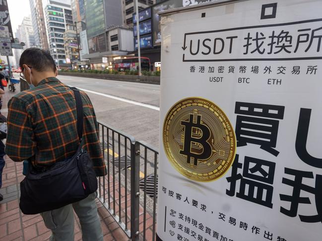 The Bitcoin logo in Hong Kong, China, on Tuesday, Dec. 5, 2023. Bitcoin shrugged off a dip in global stock markets to set another more than 19-month high, a sign of its decoupling from other assets. Photographer: Paul Yeung/Bloomberg