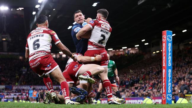 Ryan Hall of Hull Kingston Rovers is challenged by Abbas Miski of Wigan Warriors. Photo by Michael Steele/Getty Images