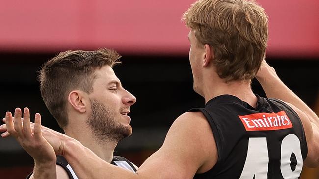 Sam Fowler (left) celebrates a goal against Richmond.