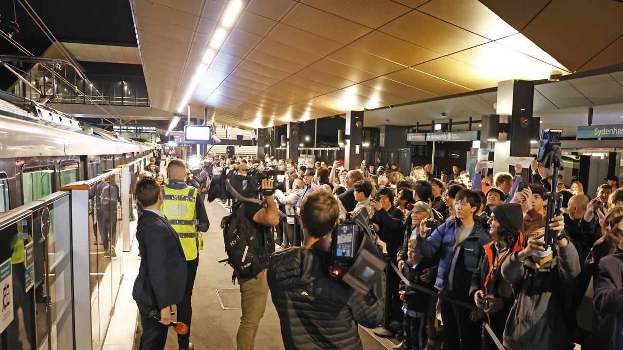 Pictured at Sydenham Station are the first passengers waiting to board the brand new Sydney Metro on its maiden run to Tallawong at 4.54am. Picture: Richard Dobson