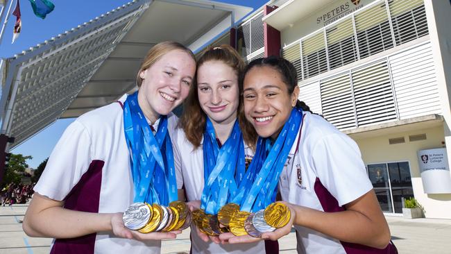 Ella Ramsay, Mollie O'Callaghan and Claveria Johnson after winning a swag of medals at the nationals this year. (AAP Image/Renae Droop)