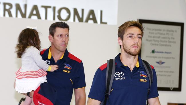 Andrew Fagan and Richard Douglas return home from Adelaide’s round 23 loss against West Coast in Perth. Picture: Sarah Reed