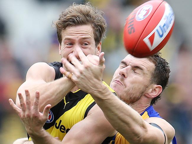 AFL Round 22. 18/08/2019. Richmond v West Coast at the MCG .   Richmonds Kane Lambert  clears infant of West Coast's Luke Shuey    . Pic: Michael Klein