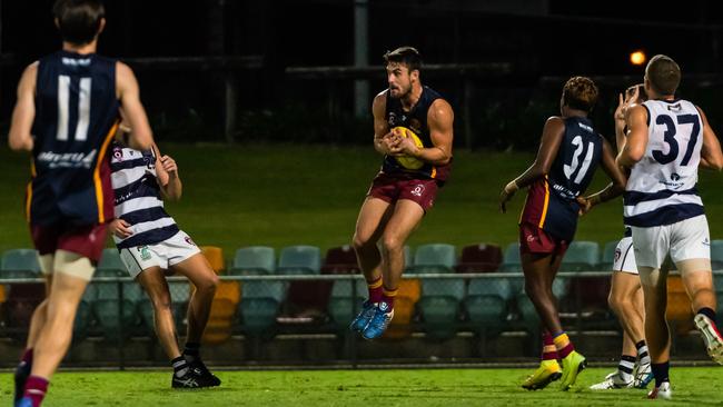 Cairns City Lions' Robert Turnbull makes a midfield catch in saturdays Mens Preliminary decider against the Port Douglas Crocs . Picture: Emily Barker.