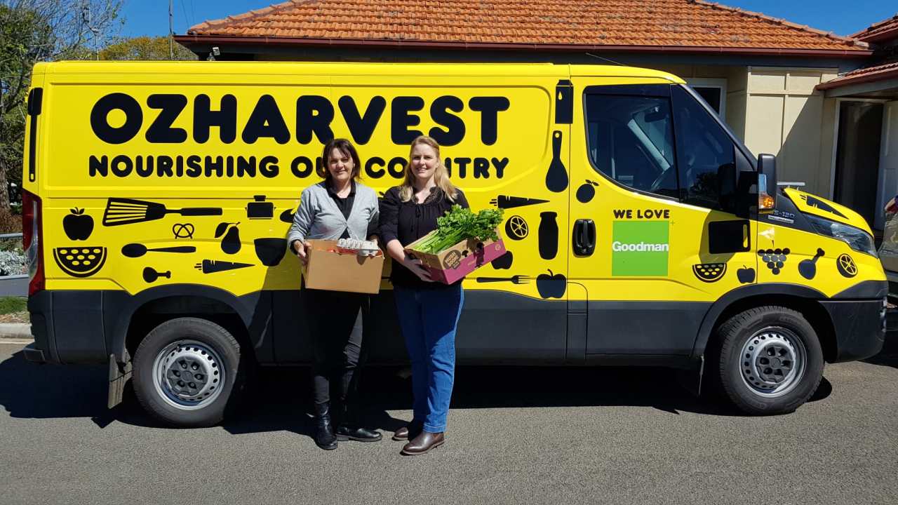 Gab (left) and Naomi from Protea Place receive a food delivery from Oz Harvest.