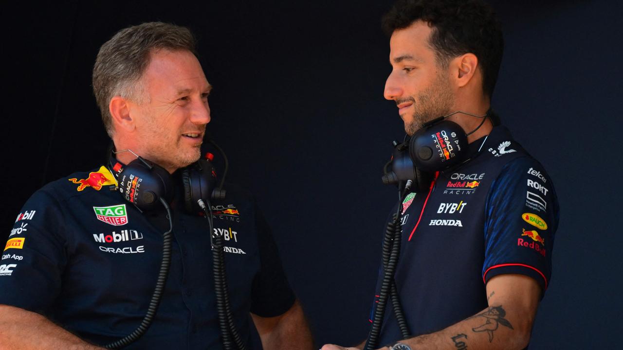 Red Bull Racing's British team principal Christian Horner (L) speaks with Red Bull Racing's Australian reserve driver Daniel Ricciardo ahead of a practice session of the ahead of the Formula One Monaco Grand Prix at the Monaco street circuit in Monaco, on May 27, 2023. (Photo by ANDREJ ISAKOVIC / AFP)