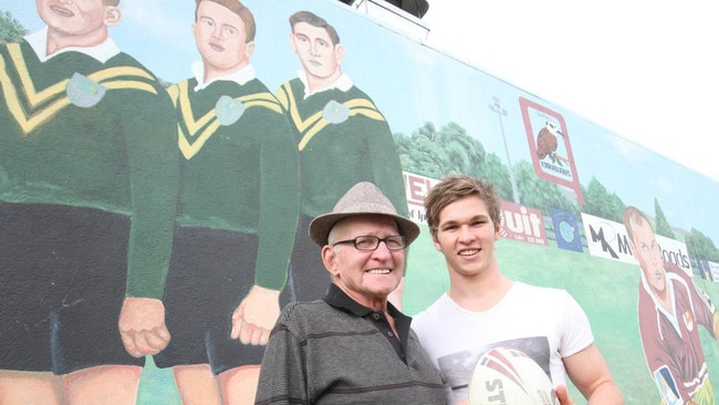 Former Australian rugby league great Gary Parcell with his grandson Matt at the North Ipswich Reserve where Gary was painted with his Ipswich and national teammates Dud Beattie and Noel Kelly.