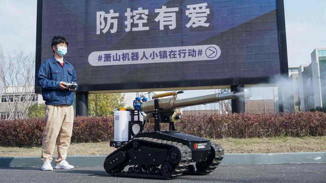 A robot is rolled out to disinfect the streets of Hangzhou in China’s eastern Zhejiang province. Picture: AFP