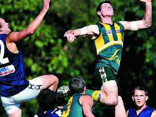 Coolangatta’s Chris Carrins, left, and Maroochy- Northshore’s Tyson Williams have eyes only for the ball. Picture: Jonathan Clifford