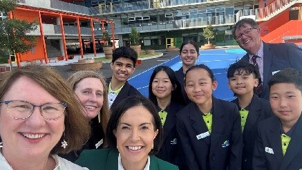 Parramatta MP Donna Davis and Education Minister Prue Car (front) with staff and students at Wentworth Point.