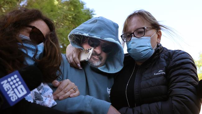 Ross Phillip Hicks is seen outside the Adelaide watch house with his wife and supporters. Picture: David Mariuz