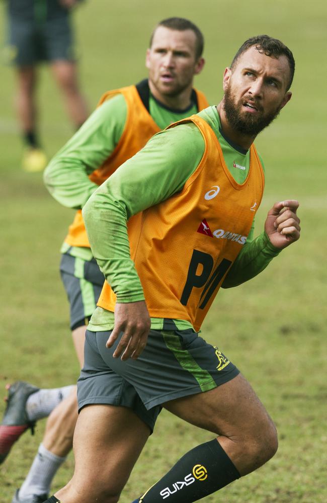 Quade Cooper with Matt Giteau behind during a Wallabies training session at Weigall Sports Ground.