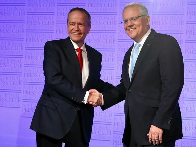 Australia's Labor leader Bill Shorten (L) and Liberal leader and prime minister, Scott Morrison, shake hands at the start of "The Leaders' Debate" at the National Press Club of Australia in Canberra on May 8, 2019. - Last week's poll showed the election will be closely fought, but also underscored the complexities of Australia's election system -- which asks voters to rank parties by preferences and encourages voting pacts between major and minor parties. (Photo by Liam KIDSTON / POOL / AFP)