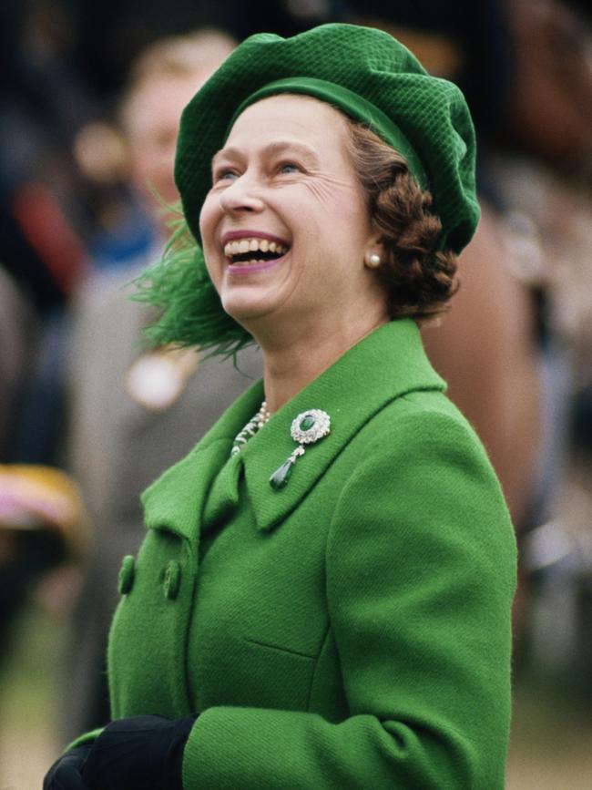 The Queen, pictured here in the 1980s, loved wearing bold colours. Picture: Getty Images