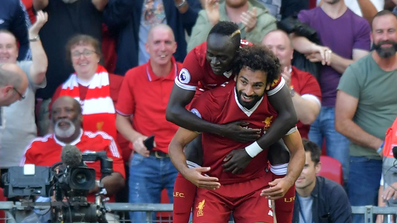 Liverpool's Egyptian midfielder Mohamed Salah (R) celebrates with Sadio Mane