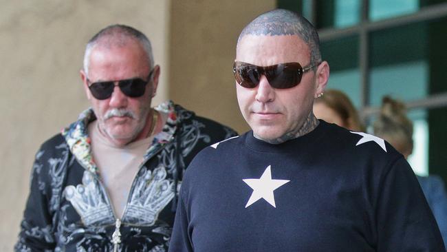 Toby Mitchell leaving Melbourne Magistrates Court with his father. Picture: Hamish Blair