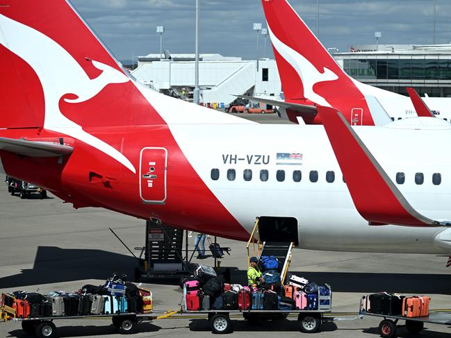 BRISBANE, AUSTRALIA - NewsWire Photos - AUGUST 11, 2022. Qantas baggage handlers at work at Brisbane airport. Industrial action will start at Qantas and budget offshoot Jetstar by the end of August amid an escalating fight over pay with its licensed engineers.Picture: NCA NewsWire / Dan Peled