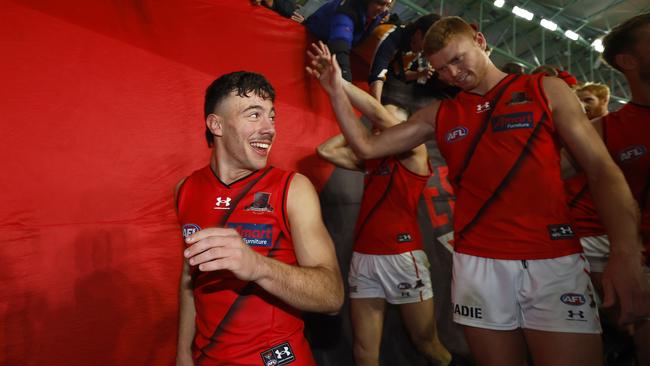 Massimo D'Ambrosio leads the Bombers into the rooms post-match after his AFL debut. Picture: Getty Images