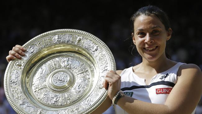 Marion Bartoli holds the 2013 Wimbledon trophy.