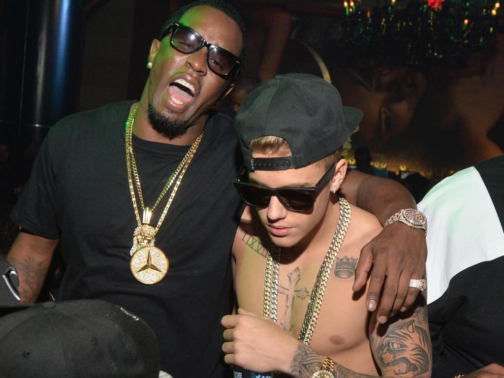 A shirtless Justin Bieber, then 19, was decked out in gold chains and sunglasses at a Ciroc vodka event in Atlanta back in 2014. Picture: Prince Williams/FilmMagic/Getty