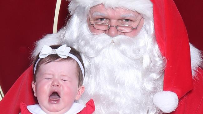 Brooke linehan "just sharing my cringe worthy photo of my daughter today who was less than impressed with Santa!"