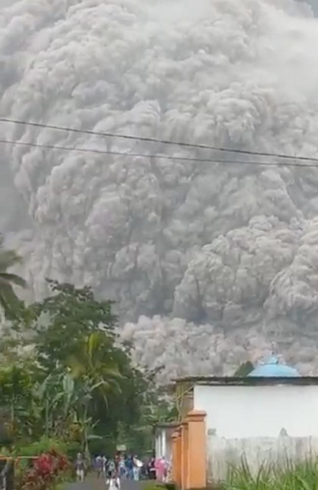 Screen grabs from Twitter account PRB Indonesia BNPB show people running from the eruption of Mt Semeru. Picture: Twitter/@PRB_BNPB