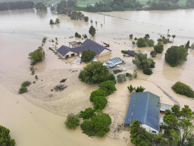 An aerial photo taken on February 14, 2023 shows flooding caused by Cyclone Gabrielle in Awatoto, near the city of Napier. - New Zealand declared a national state of emergency on February 14 as Cyclone Gabrielle swept away roads, inundated homes and left more than 100,000 people without power. (Photo by AFP) / New Zealand OUT