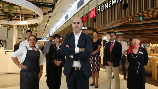 Heinemann chief executive Richard Goodman with other retailers at Sydney Airport. Picture: Britta Campion