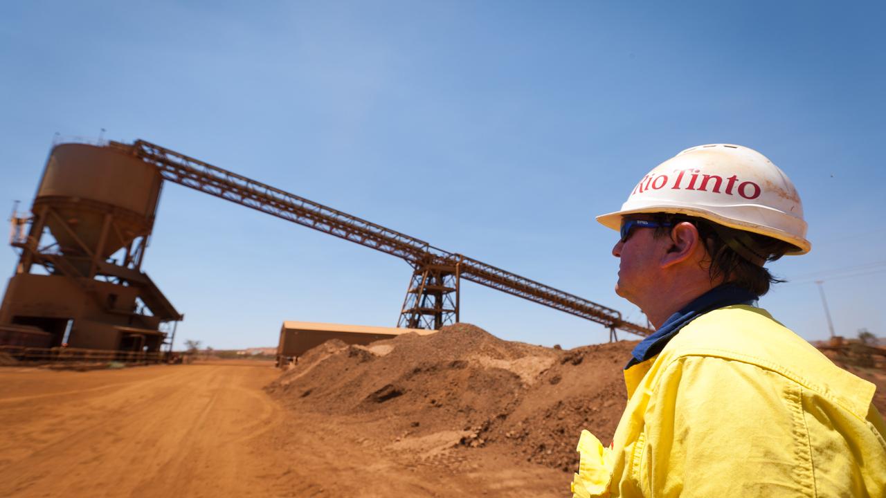 A mine worker watches a train loader at Rio Tinto Group's West Angelas iron ore mine in Pilbara. Picture: Bloomberg