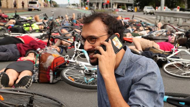 Controversial "Die in" cyclist protest led by Councillor Johnathan Sri during peak hour traffic at the corner of Vulture and Graham Streets, South Brisbane. Photographer: Liam Kidston