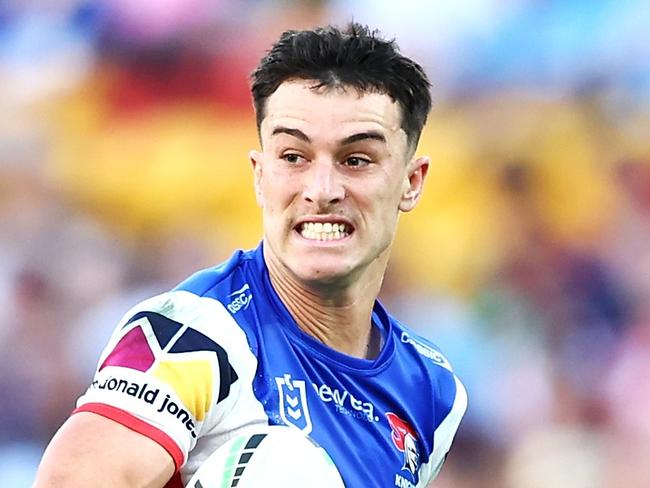 BRISBANE, AUSTRALIA - MAY 18: David Armstrong of the Knights breaks a way to score a try during the round 11 NRL match between Gold Coast Titans and Newcastle Knights at Suncorp Stadium, on May 18, 2024, in Brisbane, Australia. (Photo by Chris Hyde/Chris Hyde)