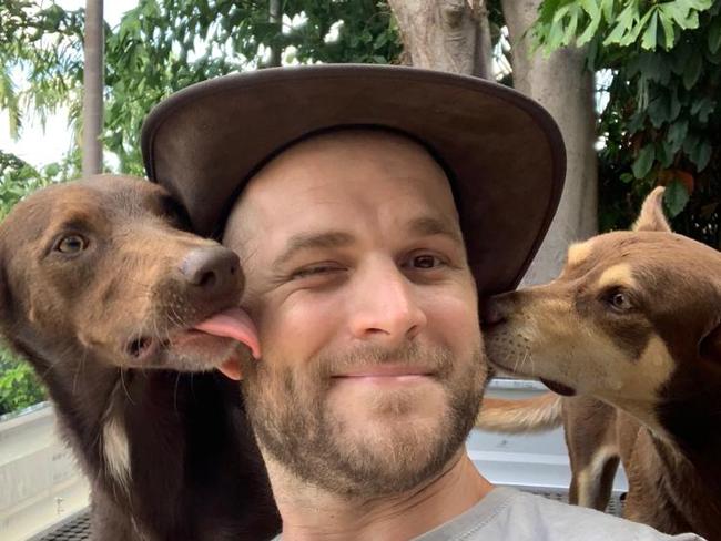 Ryan Smith, who tragically passed away earlier this month, with his dogs Rusty and Kasey. Picture: Supplied