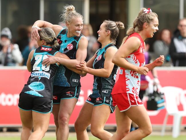 ADELAIDE, AUSTRALIA - SEPTEMBER 17: Kate Surman of the Power celebrates a goal with Erin Phillips during the 2022 S7 AFLW Round 04 match between the Port Adelaide Power and the Sydney Swans at Alberton Oval on September 17, 2022 in Adelaide, Australia. (Photo by Sarah Reed/AFL Photos via Getty Images)